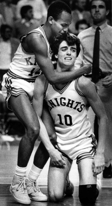 Lexington Catholic players Mike Mitchell and Danny Johnson (10) react to loos to Mason County in the boy's Sweet 16 Tournament in 1985 in Rupp Arena. Photo by Ron Garrison | staff