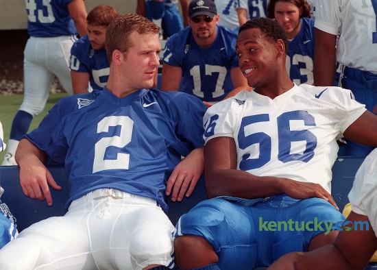University of Kentucky quarterback Tim Couch, left, talks with incoming freshman Dennis Johnson during the Wildcats's Football Media Day Aug. 13, 1998 at Commonwealth Stadium in Lexington. As a standout defensive lineman, Johnson was Kentucky's Mr. Football in 1997, and USA Today's and Sports Illustrated's national defensive player of the year. Johnson played three years at UK and was a third-team All-American and a first-team All-Southeastern Conference player. He left UK early to enter the the NFL draft and played in the league for three years. On March 23, 2015 he was named Woodford County's head football coach. Photo by David Stephenson | staff