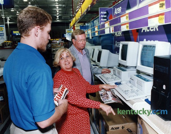 Jim and Rachel Daniels of Frankfort, got some help in shopping for a new computer system from Best Buy salesperson Noah Cyboron Oct. 4, 1994. Note the price for the machine they were looking at: $1,296. Photo by Drew Fritz
