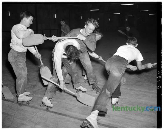 Broomball hockey being played at Scott's Roll-Arena in Lexington. The photo shows the Black Raiders and the Eight-Balls scrambling for the inflated volleyball. Published in the Herald-Leader February 20, 1949. Herald-Leader Archive Photo