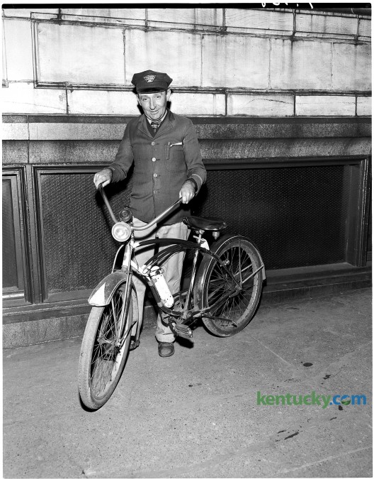 Western Union Telegraph Company messenger Billy Bush and his bicycle, January 1951. Bush served as a company messenger for over 30 years. Herald-Leader archive photo