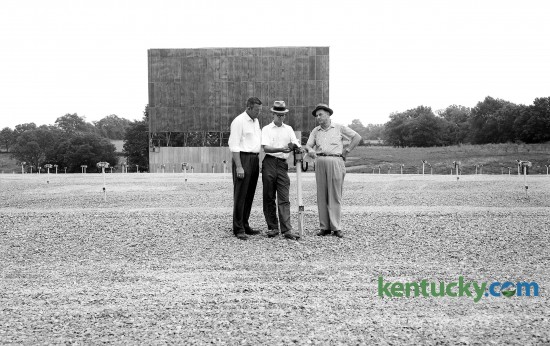 From left, J.M. Mahaffey, Bob Perkins and M.C. Hughes inspect a speaker unit Aug. 12, 1961 at the new Southland 68 Drive-In Theater on Harrodsburg Road just across the Fayette, Jessamine Co. line. In the background is the backdrop for what is billed as the "world's largest drive0in movie screen". The drive-in closed in the mid-1980's and is now Bellerive Plaza, whcih includes a Kroger. Herald-Leader archive photo.