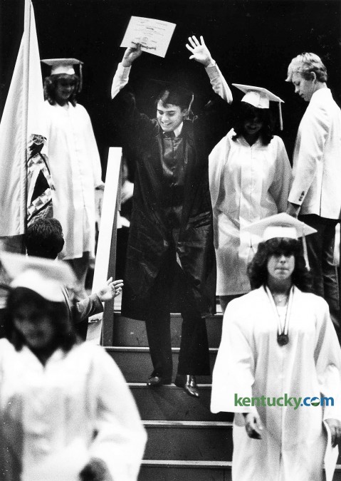 Anthony Lister celebrates getting his high school diploma as he makes his way down the steps on the way back to his seat during Lafayette's graduation ceremony, May 25, 1984 at Rupp Arena. Lafayette and Tates Creek high schools celebrate the 2015 graduating class on May 30. Photo by Ron Garrison | staff