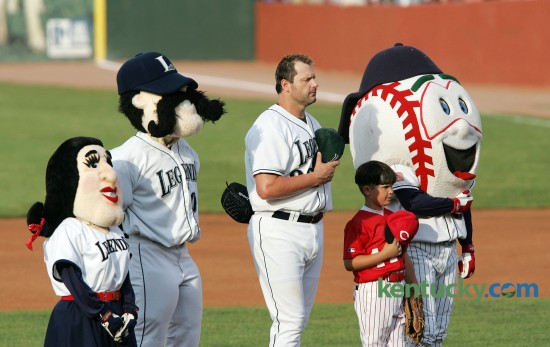 Lexington Legends starting pitcher Roger Clemens was joined by the Legends mascots and 8-year-old Jonah Dixon, a member of the Southwest Lexington Reds, for the National Anthem before he pitched June 06, 2006. Clemens, nicknamed "Rocket", chose to come out of retirement and signed with the Houston Astros. He was in Lexington for his first rehab start which was before a record crowd of 9,222 at Applebee's Park, an overflow media contingent, a national TV audience and his son Koby playing third base. At 7:09 p.m. -- after a nearly weeklong buildup, and after the public address system had played Elton John's Rocket Man -- the 43-year-old Clemens, maybe the finest pitcher the game has ever known, took the mound for what he called "Step one." Sixty minutes and 62 pitches later it was over. Clemens pitched three innings, and allowed three hits including a home run to Lake County's Johnny Drennen. He also struck out six and hit a batter. "It felt great," Clemens, sporting a Texas Longhorns cap, said afterward. Clemens ended up playing for three more seasons and retired again in 2007. Photo by Charles Bertram | staff