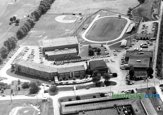 Madison Central High School in Richmond, March, 1977. Around the time of this picture, the school opened it's new gym, located just under the baseball field. The building on the right is the school's vocational facility. Photo by John C. Wyatt | staff  Red House Road