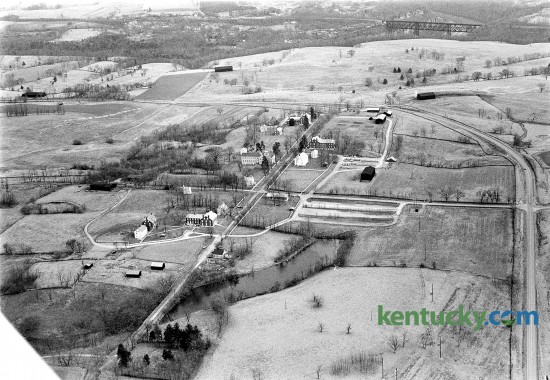 Aerial picture of Shaker Village of Pleasant Hill in Harrodsburg, Jan. 23, 1973. It is America’s largest restored Shaker village. In the upper right corner is High Bridge spanning over the Kentucky River. U.S. 68 (Lexington Road) runs up the right side of the picture and curves around the Shaker property. Herald-Leader archive photo