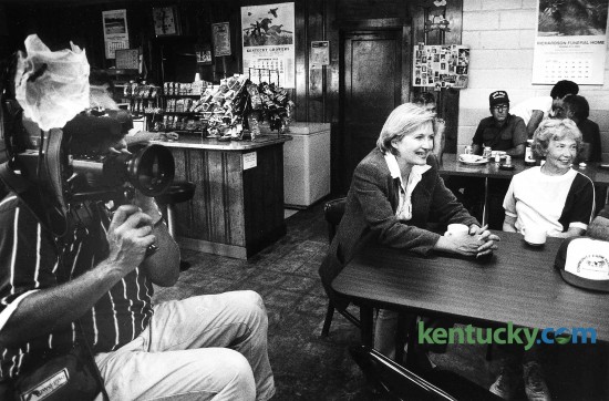 Television journalist Diane Sawyer, center, talks to farmers in Pam and Erma's Restaurant in Bath County, Sept. 2, 1992. An ABC news crew and Sawyer, a Kentucky native, filmed footage for a program on welfare reform. The segment on ABC's "PrimeTime Live", examined the welfare economy and the chronic shortage of labor on Kentucky tobacco farms. After the piece aired, several Kentucky farmers featured were stunned by the portrayal of rampant abuse. Sawyer and an ABC news crew took hidden cameras to 30 welfare offices and other sites nationwide showing several people cheating the system. John Botts, a Bath County tobacco farmer who was interviewed at Erma and Pam's Restaurant in Bethel, said the program showed "why our country is in the shape it is in." Welfare, he said, is a good program, but too many people abuse it. Photo by Tim Sharp | staff