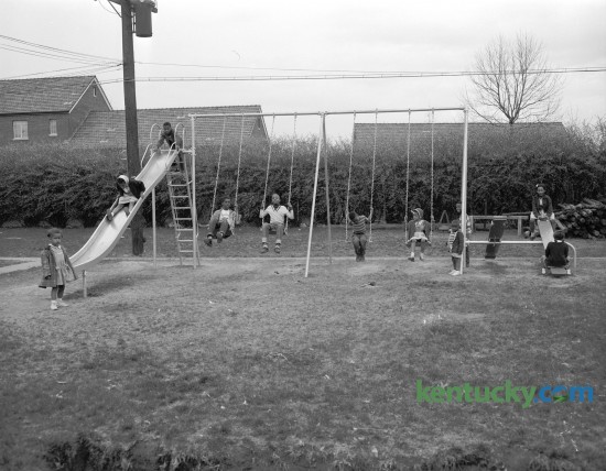 One of the playgrounds in the African American section of the Bluegrass-Aspendale housing project in Lexington's east side in April 1954. An eight-foot fence separated blacks and whites from 1939 until January 1974. Published in the Lexington Herald-Leader April 18, 1954. Herald-Leader Archive Photo