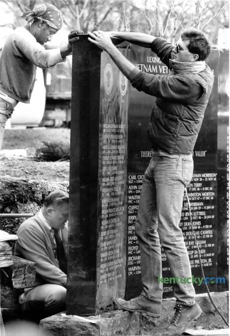 Workers placed Fayette County's Vietnam Veteran's Memorial in Central Park in 1987. Walter Christian, top left, M.E. Wilkerson, lower left and Eddie Wilkerson of Kentucky Monument Service aligned one of the three black granite sections of the Vietnam Veteran's monument on January 6, 1986. The monument weighs about 9000 pounds and contains the names of Fayette County's 50 dead or missing in action veterans. The memorial was formerly dedicated on January 10, 1987. Photo by David Perry | Staff