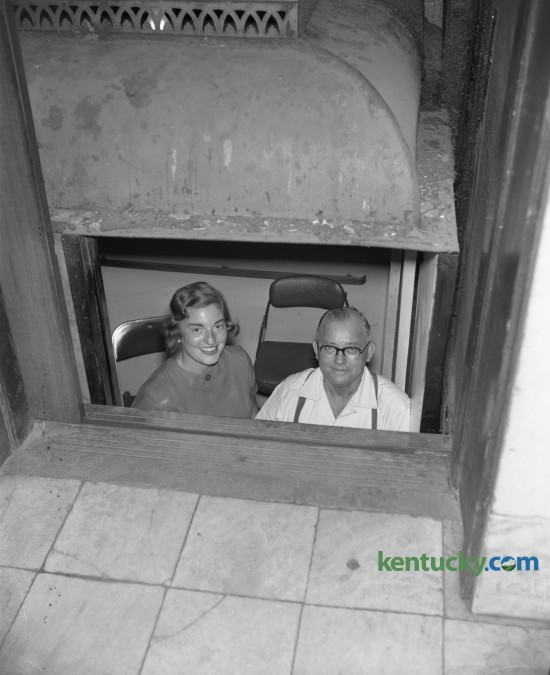 Miss Bobbie Harris and Edgar Hunter, elevator operator at the Courthouse, shown on elevator in which they were stuck for 50 minutes in July of 1958. Published in the Lexington Herald July 22, 1958. Herald-Leader Archive Photo