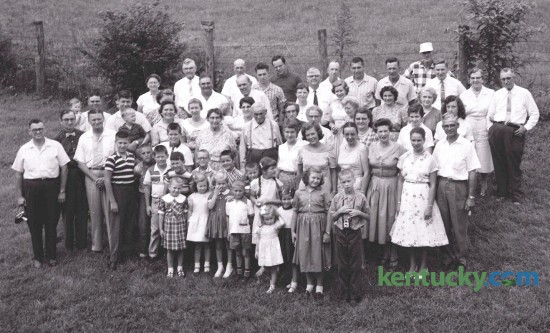About 80 members of the Lee and Fayette County Congletons held their annual family reunion at the  Old Homeplace near Beattyville in 1958. This occasion is held each summer on or near the birthday of Hill Congleton, center, one of the older members of  the family who was 85 in 1958. Published in the Lexington Leader August 5, 1958. Herald-Leader Archive Photo