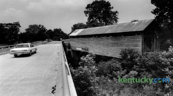 Kentucky highway 158 runs beside Ringo's Mill covered bridge in Fleming County south of Hillsboro.  The 90-foot-long single span Burr truss bridge was built in 1867 and served as a link to Ringo's Mill, a grist mill operated during the 1800's. Photographed June 30, 1981. Photo by Charles Bertram | Staff