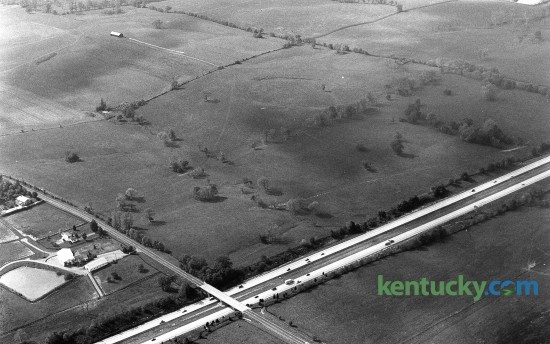 Aerial picture of Hamburg Place horse farm in eastern Fayette County, Oct. 17, 1986. During the 1990s, part of the farm would be developed to be come Hamburg Pavilion, one of the state's largest shopping centers. In the photo, I-75 runs from left to right across the bottom. Intersecting with it is Bryant Road, which would later become part of the Man o' War Boulevard extension that took place in 1988. Today, Target, Old Navy and Dick's Sporting Goods are some of the retail stores that line I-75 on the west side. On the east is Costco and Cabela's, whcih is currently under constrction. About half of the 2,000 acre Hamburg Place farm has now been developed. Photo by Charles Bertram | staff