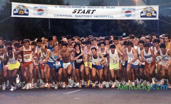 The start of A Midsummer Night's Run, Aug. 18, 1990 in downtown Lexington. The 5K sponsored by Baptist Health Lexington has been an annual summer event since it's first race in 1985 that featured 1,300 participants. The 2015 race on Saturday, Aug. 8 is expected to almost triple that. Photo by Tim Sharp | staff