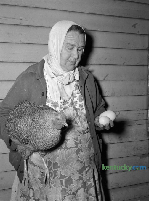 Margaret Mink held a pullet which laid a double-shelled egg weighing more than half a pound. Published in the Lexington Herald March 2, 1948. Herald-Leader Archive Photo