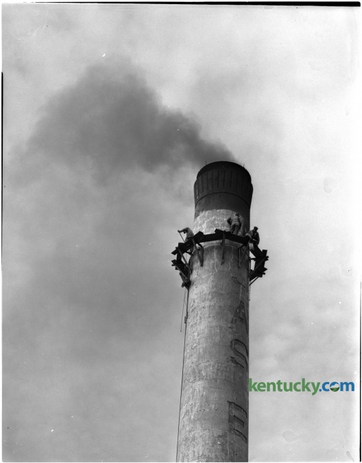 Men at work near the top of the 130-foot smokestack at the Old Pepper Distillery for a painting and patching job. Published in the Lexington Herald-Leader January 14, 1951. Herald-Leader Archive Photo