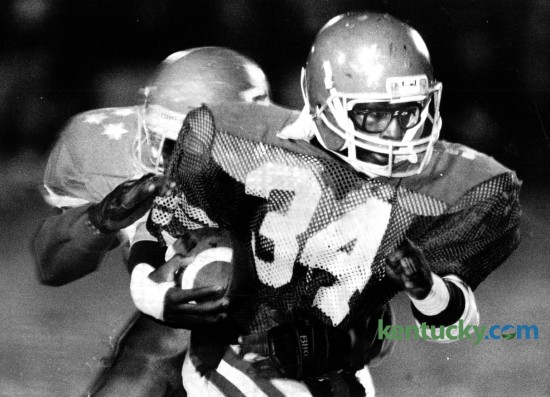 Henry Clay's Tyrone Groves (34) tried to outrun Lafayette's Robert Webb during their inter-city matchup on October 28, 1988. The 5-foot-10, 158-pound junior rushed 19 times for 186 yards. Henry Clay took advantage of six Lafayette turnovers to score a 33-14 season-ending victory and spoil the Generals' high school football homecoming. Photo by Tim Sharp | Staff