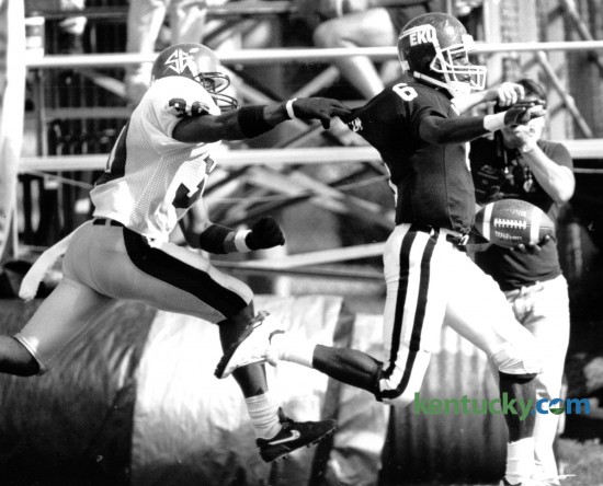 South East Missouri State's Steve Bryant, left, made a touchdown saving tackle on Eastern Kentucky University's Kenny McCollum after he made a long gain on an end-around run early in the third quarter at EKU on October 3, 1992. EKU won the game 20-10. Photo by Charles Bertram | Staff