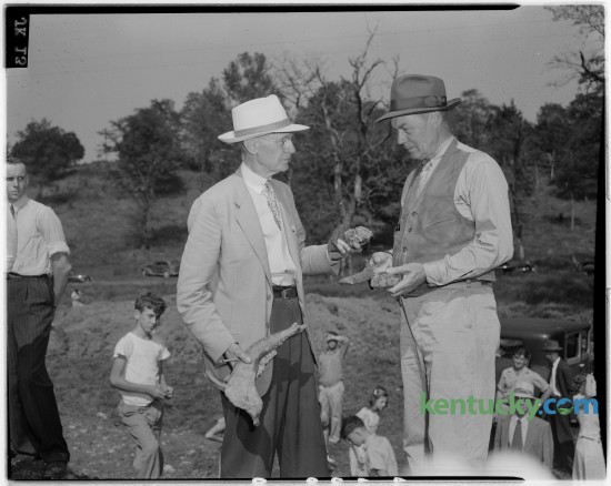 Victor K. Dodge, Lexington, and Dr. W. R. Jillson, Frankfort, were pictured at excavations near Blue Licks Battlefield State Park in Robertson County where bones of prehistoric animals were found. Known as the site of the last battle of the American Revolution, it is also an important historical site due to the discovery of fossils of large animals that once visited the salt licks formed from the springs in the area. This Saturday Blue Licks Battlefield State Resort Park will hold a fossils of Kentucky event where paleontologist/interpretive naturalist Alan Goldstein will look at local fossils and help identify fossils brought to the event. Published in the Lexington Herald September 16, 1946. Herald-Leader Archive Photo