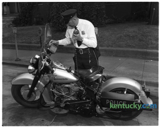 City Patrolman Joe Modica operating the two-way radio on one of the new motorcycles purchased by traffic division of Lexington Police department in June of 1949. Published in the Lexington Herald June 13, 1949. Herald-Leader Archive Photo