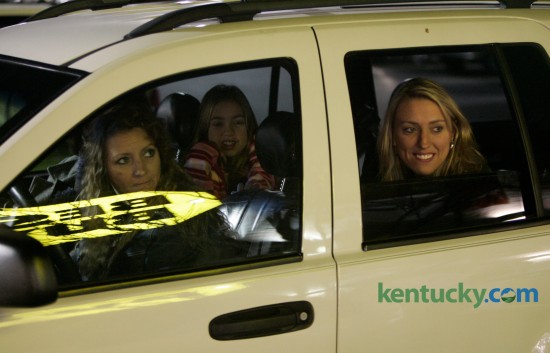 Four generations of shoppers, great-grandmother Jo Ann Cox, in the front passenger seat, grandmother Karen Roberts, left, mother Kellie Sparks, right, and great-granddaughter Mariah Polly, all from Lawrenceburg, keep warm in their car instead of standing in line to get into Best Buy which opened at 5 a.m. on Black Friday, the traditional first day of the holiday shopping season, in Lexington, Ky., on Friday, November 25, 2005. David Stephenson | Staff