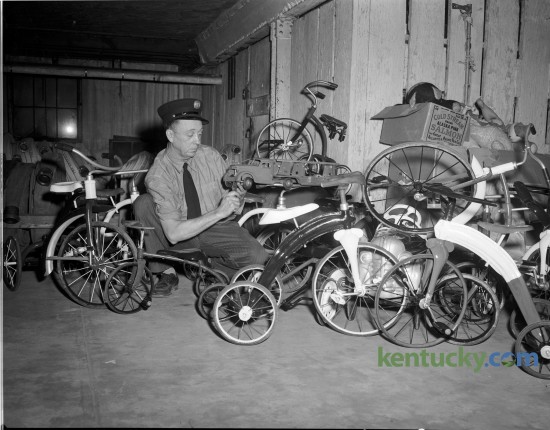 W. T. Kerns, a mechanic with the Lexington Fire Department, with some of the toys he repaired for underprivileged children in December 1948.  Kerns spent many off-duty hours repairing and painting toys for the Blue Grass Council of the Boy Scouts of AmericaToy Drive. Published in the Lexington Leader December 21, 1948. Lexington’s Fraternal Order of Firefighters kicks off it's its 84th Annual Toy Drive this Friday. Herald-Leader Archive Photo