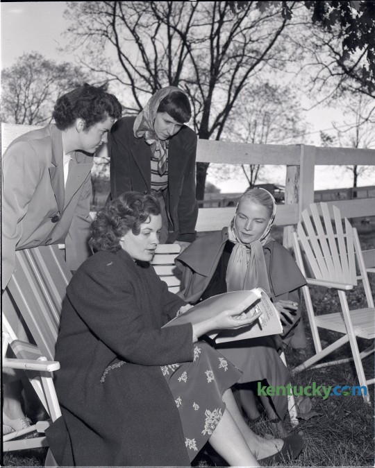Actress Jean Hagen, seated, left, went over her script before filming the final scene in The Asphalt Jungle, on the Ben Eubank farm on Briar Hill Road in October 1949. Also shown in the photo are Mrs. James Steele, standing, left, Mrs. Ben Eubank Jr., standing, right, and Mrs. Sterling Hayden, seated, right. The Asphalt Jungle is a 1950 film noir directed by John Huston. The cast also featured  Sterling Hayden, Sam Jaffe, Louis Calhern, James Whitmore, and, in a minor but key role, Marilyn Monroe. Published in the Lexington Leader October 14, 1949. Herald-Leader Archive Photo