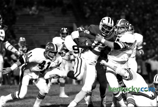 Georgia middle guard Brad Cescutti pulled Kentucky quarterback Derrick Ramsey to a stop afer an eight-yard gain on October 23, 1976. Ramsey was hemmed in by the Bulldogs all evening and ran for only 28 years in 15 carries in the Wildcats' first loss on the season at Commonwealth Stadium, 31-7. Photo by David Perry | Staff
