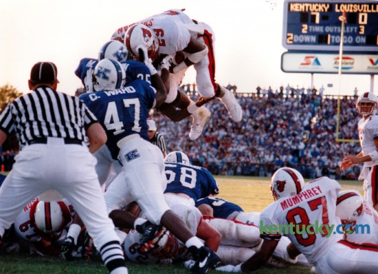 In the second quarter, U of L halfback Anthony Shelman dove over the Wildcat defense for Louisville's first touchdown in the first Governor's Cup on September 3, 1994 in Commonwealth Stadium. Kentucky went on to win game 20-14. Photo by David Perry | Staff