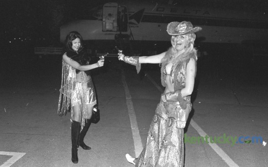 Exotic dancers Vienna Ithier, left and Patricia Sands offered a not-so-fiery protest against airport "anti-hijacking" security measures at Blue Grass Field May 13, 1973. They wore their costumes on the plane from Chicago so the outfits wouldn't be mishandled by airport security. They claimed garments from their on-stage wardrobe were continuallly being "ripped and torn" by security police at various airports. The entertainers, in Lexington for a nightclub engagement, were clowning for news photographers after disenbarking. Herald-Leader Archive Photo