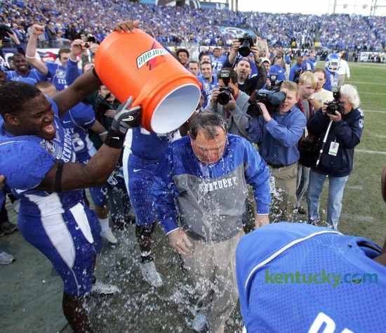 University of Kentucky coach Rich Brooks got a Gatorade bath after the Cats defeated Clemson, 28-20 in the Music City Bowl at LP Field in Nashville, Dec. 29, 2006. A Music City Bowl record 68,024 fans witnessed UK's first bowl victory in 22 years thanks to MVP Andre Woodson's 299 yards passing with three touchdowns. UK would make another trip to the Music City Bowl the following year, beating Florida State 35-28. Photo by Charles Bertram | staff