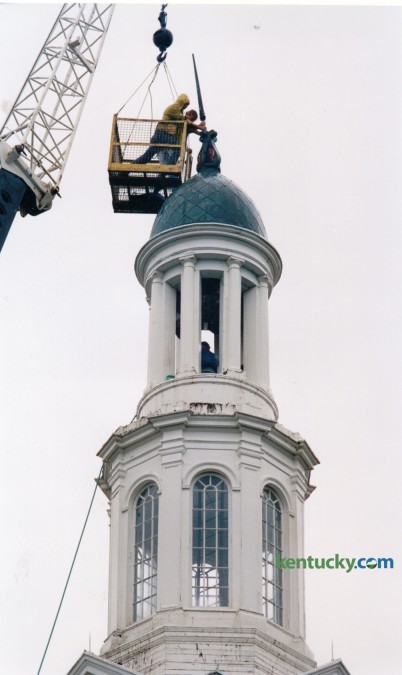 Charles Cunliffe, left and David Roberts, both UK Physical Plant employees worked to repair the lightning rod on top of the steeple on Memorial Hall on September 18, 1992. The tower was struck by lightning during an early morning storm. Firefighters returning from a false alarm on the UK campus about 3:30 a.m. smelled smoke as they neared their Scott Street station. They looked around and spotted a red glow coming from the copper-covered steeple atop Memorial Hall across the street. Lightning had apparently struck the landmark building, bent the lightning rod and set the tower on fire.  Firefighters climbed to the top of the steeple and spread tarps so water from their hoses would trickle off the roof and not damage the building's interior. The fire was quickly extinquished. Photo by Charles Bertram | Staff