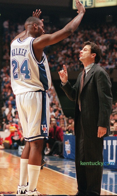 Wildcat coach Rick Pitino talks with forward Antoine Walker during No. 4 Kentucky's 89-66 win over No. 25 Louisville, Dec. 23, 1995 at Rupp Arena in Lexington. Walker had 20 points and 12 rebounds, and guard Tony Delk had 30 points guiding the Cats' to their seventh win on the season. UK would finish the year 34-2 and the programs sixth national title. Photo by Frank Anderson | staff