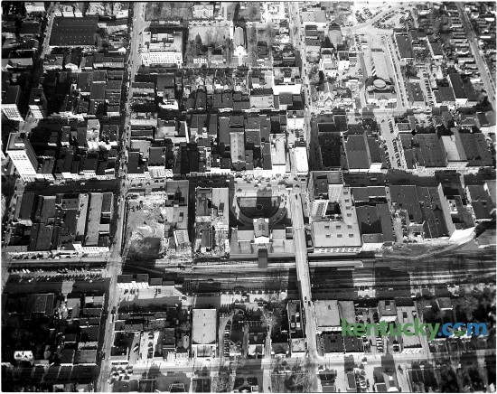 Aerial view of downtown Lexington in August of 1956. The photo's purpose was to show the C&O Railroad tracks in downtown which the city was trying to have removed. The tracks run horizontally just below the middle of the photo. Vine St. is now located where the tracks are in the photo. The old Union Station, with the semi-circular drive, is near the center of the photo. Published in the Lexington Leader August 1, 1956. Herald-Leader Archive Photo