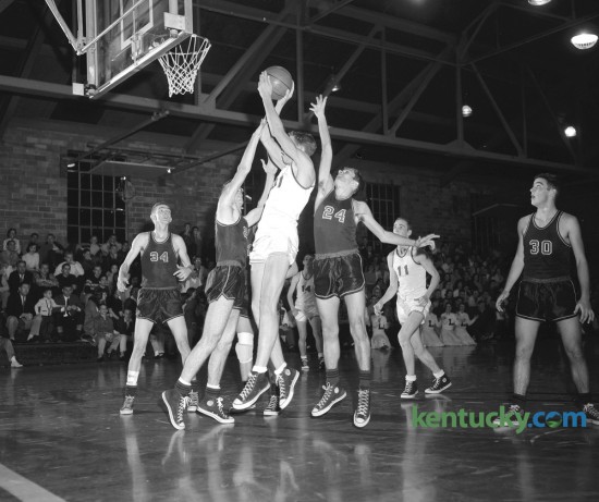 Lafayette High School's Jeff Mullins leaped off the floor to fire a shot as Hartford's Chip Combs, tried to block it on January 24,1959. The Generals, playing on their home court won 85-65. Senior guard Jon Speaks and junior forward Jeff Mullins paced the Generals with 24 points apiece. Published January 25, 1959. Lafayette plays Trinity tonight in Louisville. Herald-Leader Archive Photo