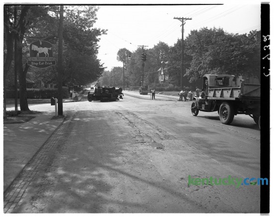 Resurfacing of Richmond Road, at the intersection of Ashland Avenue, Aug. 26, 1948. The resurfacing was one of the final parts of a year-long project to widen Richmond Road from two lanes to four, to an area just past Idle Hour Country Club, but before the Lexington reservoir. Over the years, more restaurants have been at this intersection, 735 East Main Street, than perhaps any other location in town. At left is the sign for the first restaurant at this address, the Stirrup Cup, whcih opened in 1938. It closed in the 1960s but reopened in 1980, only to close again in 1982. Today it is Coles 735 Main restaurant. Herald-Leader archive photo.