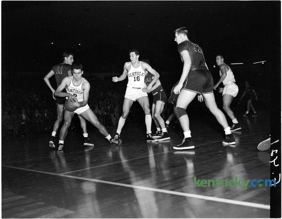 University of Kentucky sophomore Cliff Hagan grabbed a lose ball during the No.1-ranked Cats' 88-41 win over Georgia, Feb. 23, 1951 at Memorial Coliseum in Lexington. This was UK's first season playing in Memorial Coliseum, which was completed in 1950 at a cost of $3.9 million. UK's Lou Tsioropoulos (16), is at center. UK would finish the season 32-2, winning it's 14th SEC regular season title and later it's third NCAA championship with a 68-58 win over defeated Kansas State. Herald-Leader Archive Photo