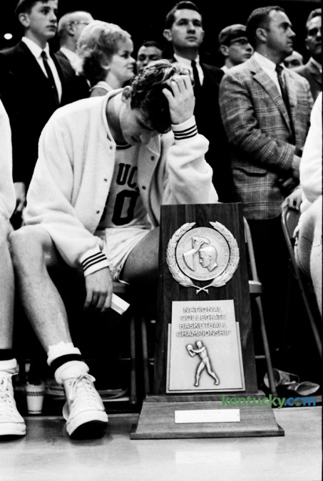 Kentucky guard Tom Kron slumped in his chair in front of the runner-up trophy during presentations following Kentucky's loss to Texas Western in the NCAA championship game on March 19, 1966 in College Park, Md. Photo by Jeff Watkins | Staff