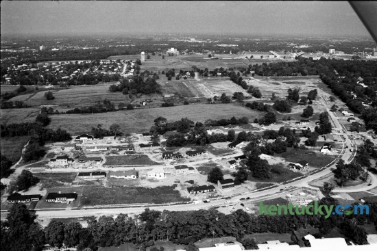 Aerial view of the Ware Farm in late August 1973, which was one of the last remaining pieces of undeveloped property within Fayette County's Urban Service Area. The curving road at the bottom of the photo is Turkey Foot Road which leads to Tates Creek Pike, running left to right near the top of the photo. Commonwealth Stadium, which opened in September 1973, is seen at the top right. Photo by John C. Wyatt | Staff