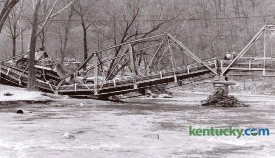 A span of the Brookside bridge over Clover Fork in Harlan County collapsed on March 13, 1978 when an Eastover Mining Company truck pulling a trailer with a bulldozer attempted to cross the bridge. The 60-year-old trestle bridge was on Ky. 38, a narrow twisting blacktop road that was a major highway for the mining and logging areas east of Harlan. Photo by Ron Garrison | Staff