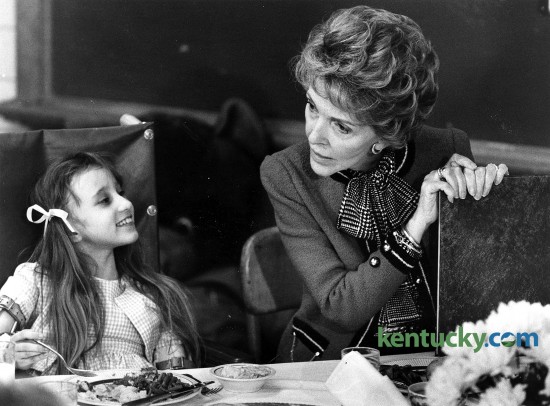 First lady Nancy Reagan had lunch with Tracy, 8, and other young patients at Shriners Hospital on Nov. 2, 1984, during a campaign swing through Southern states three days before the presidential election. Ronald Reagan, her husband, would be elected in a landslide, carrying 49 of the 50 states and narrowly losing Minnesota, the home state of Democratic challenger Walter Mondale. Nancy Reagan, who died Sunday at age 94, was known during her husband's presidency for her "Just say no" drug-abuse prevention campaign aimed at youngsters. At Shriners, Dr. David B. Stevens, the chief of staff at Shriners and a former student of Nancy Reagan's stepfather, renowned neurosurgeon Loyal Davis, gave her a tour. It took about an hour, and she visited each of the 34 patients at the 50-bed hospital. During a Herald-Leader interview that day, Reagan spoke positively of Geraldine Ferraro, Mondale's running mate and the nation's first female vice presidential candidate of a major party. She called Ferraro's candidacy "a natural progression" for women, and said she didn't seen any reason why a woman couldn't be president one day. Photo by David Perry | Staff