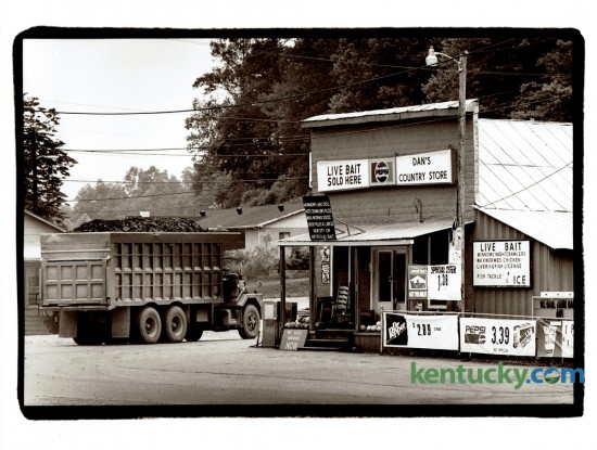 A coal truck moved past Dan's Country Store in Chavies, Ky. in June 1993. Store owner Dan Farler said his store, which featured a mini museum of coal mining equipment, was a popular lunch spot for coal truck drivers. The photo ran with with story about a day trip to Perry County. Photo by Charles Bertram | Staff
