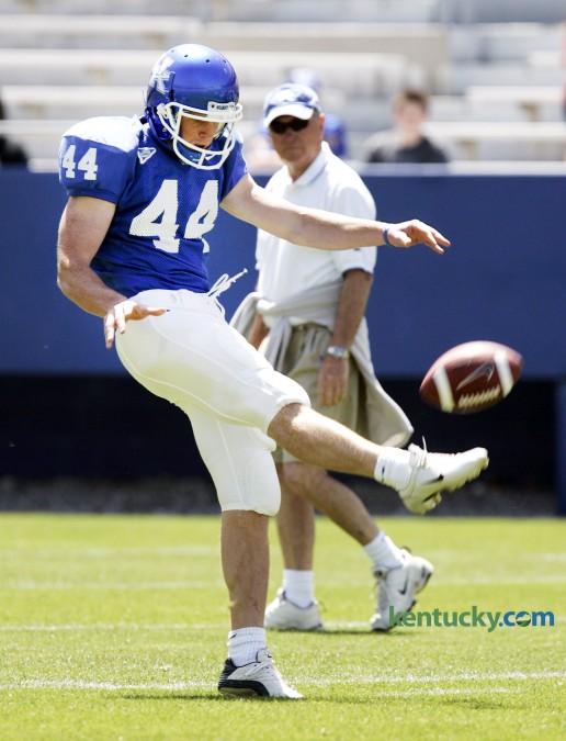 University of Kentucky punter Tim Masthay got off a clear punt under the watchful eye of head coach Rich Brooks during the spring Blue-White football game April 22, 2006 at Commonwealth Stadium. Later that year, Brooks guided UK to its first bowl game in seaven seasons. The Cats beat Clenson in the Music City Bowl, finishing the season at 8-5, 4-4 in the SEC. Brooks coached the Cats from 2003-09, compiling a 39-47 record. Masthay, a sophmore-to-be at the time of this picture, was a four-year starting punter for the Wildcats. He was a 1st team All-SEC selection his senior year in 2008 and is currently the punter for the NFL's Green Bay Packers. Photo by David Stephenson | Staff