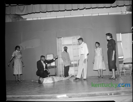 Senior play at Douglass High School. The cast includes, from left, Mary Laine, Robert Shy, George Bell, Donald Demus, Andrew Fisher, Joan Miller and Anita Bledsoe. Other characters are portrayed by Helen Caise, Waller Edwards, Douglas Holland and Gladys Hayes. Published in the Herald-Leader April 14, 1957. Herald-Leader Archive Photo
