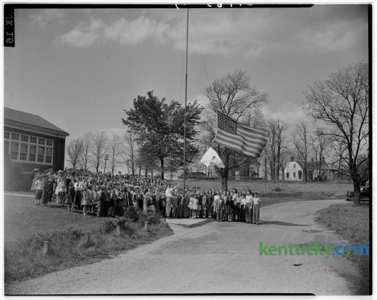 Students and teachers lined up for a photo during their schools-at-war flag raising at Linlee school April 18, 1945.  The flag was presented by the Linlee PTA because 90 percent of student body made monthly purchases of war stamps. The school was first in the county to reach the 90 percent mark. Published in the Lexington Herald April 19, 1945. Herald-Leader Archive Photo