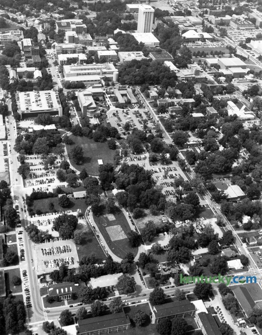 Aerial photo of the area of the University of Kentucky campus showing the site of the new library on August 26, 1993. What would be named the W.T. Young library was built in the lower center area of the photo and bounded by Hilltop Ave, at left, and Woodland Ave, across the bottom of the photo. Construction begain in 1994 and the library was dedicated in 1998. Photo by Ron Garrison | Staff