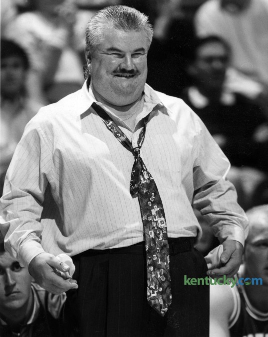 Morehead State basketball coach Dick Fick reacts to an officials call during the Eagle's 97-61 loss to Kentucky at Rupp Arena Dec. 17, 1993. The flamboyant coach led the Eagles for six rollicking years (1991-97) and compiled a 64-101 record. He was known so well known for his sideline antics that the late Jim Valvano of ESPN handed out the "Dick Fick Award," which went weekly to the coach who showed the most sideline animation. Once, in a game in Cincinnati, Fick held up a three-point sign to the UC student body every time Morehead made a three-pointer. His most famous moment came in 1992 in a game against Kentucky in Rupp Arena. MSU was victimized by an over-the-back call. In response, Fick collapsed flat on his back, his arms elevated straight up in disgust. But Fick could be every bit as clever as he was ebullient. One summer, he picked up a newspaper and saw that University of Cincinnati center Art Long had been arrested for punching a police horse. He was immediately on the phone to Bearcats Coach Bob Huggins. "Bob, I can help you," Fick said. "I know there is no way Art Long punched that horse." Huggins: "How?" Fick: "He's still in the lane from when we played you last year." In 1997, Morehead refused to extend Fick's contract and in 1999, he publicly admitted that he was an alcoholic after he was in and out of alcohol treatment programs. He wound up back in his hometown of Joliet, Ill., part-time assistant coaching at St. Francis of Illinois, a NAIA school. On April 28, 2003, the 50-year-old was found dead in the Joliet apartment where he lived by himself. Photo by Frank Anderson | staff