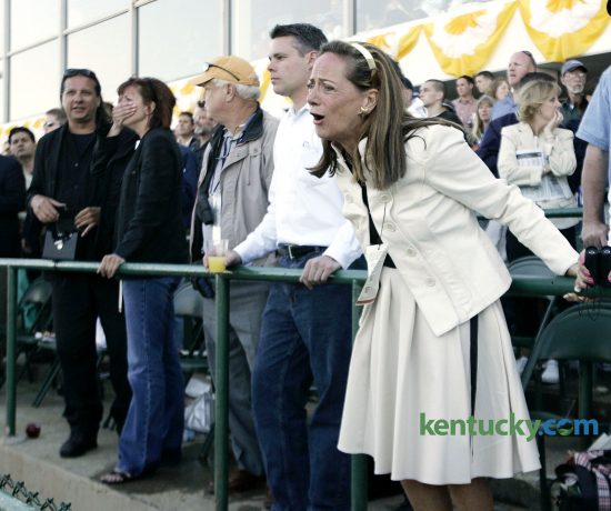 Fans react to watching Barbaro struggle to load onto the ambulance after he broke his leg after the start of the Preakness Stakes at Pimlico Race Course in Baltimore, Md., on Saturday, May 20, 2006. David Stephenson/Staff