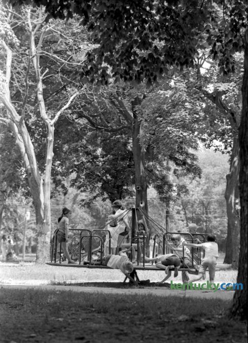 The merry-go-round at Woodland Park in Lexington served as a good place for children to enjoy the Memorial Day holiday, May 29, 1972. Published in the Lexington Leader, May 30, 1972. Herald-Leader archive photo