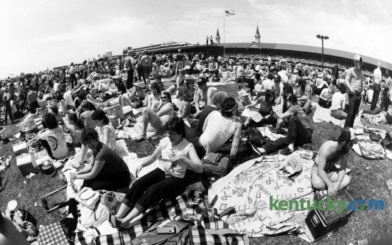 The crowd in the infield on Derby Day, May 7, 1983 at Churchill Downs. The crowd of 85,000 spread out across the 144 acres of the infield was described by Kentucky Derby regulars as one of the raunchiest in memory. Across the grounds, women found themselves as instant celebrities as they lifted their shirts to the cheers of many around. Photo by Charles Bertram | staff